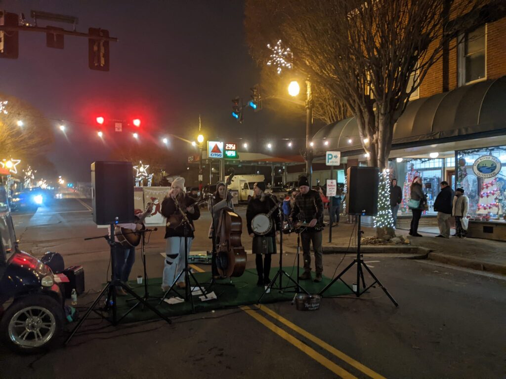 Street musicians performing during the 2024 Old Time Appalachian Christmas Festival in downtown Galax.