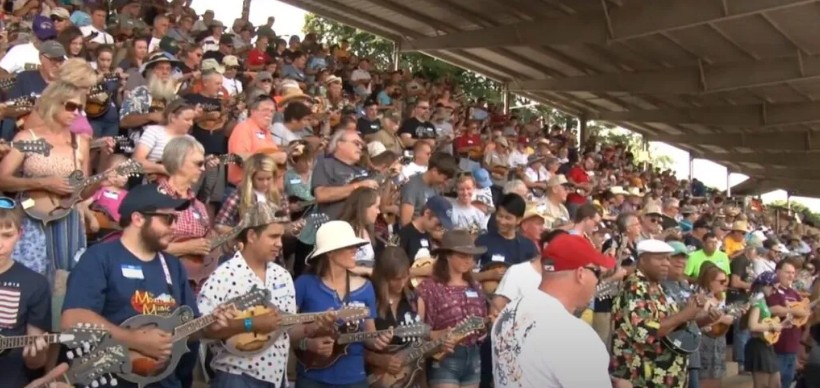 Musicians fill the grandstand at Felts Park during a large Old Fiddlers’ Convention gathering