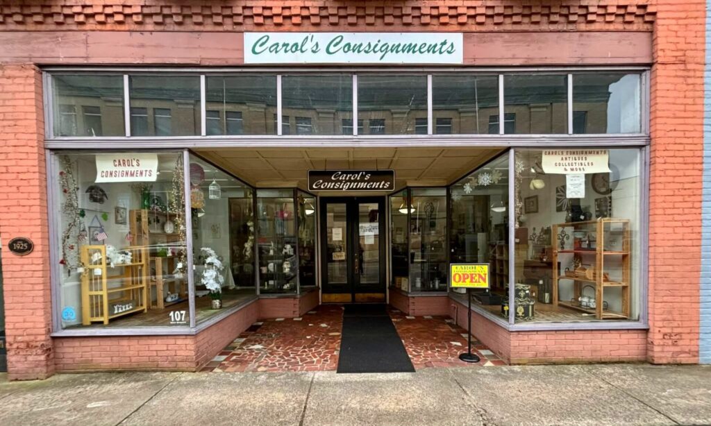 Storefront of Galax antique stores featuring Carol’s Consignments with display windows