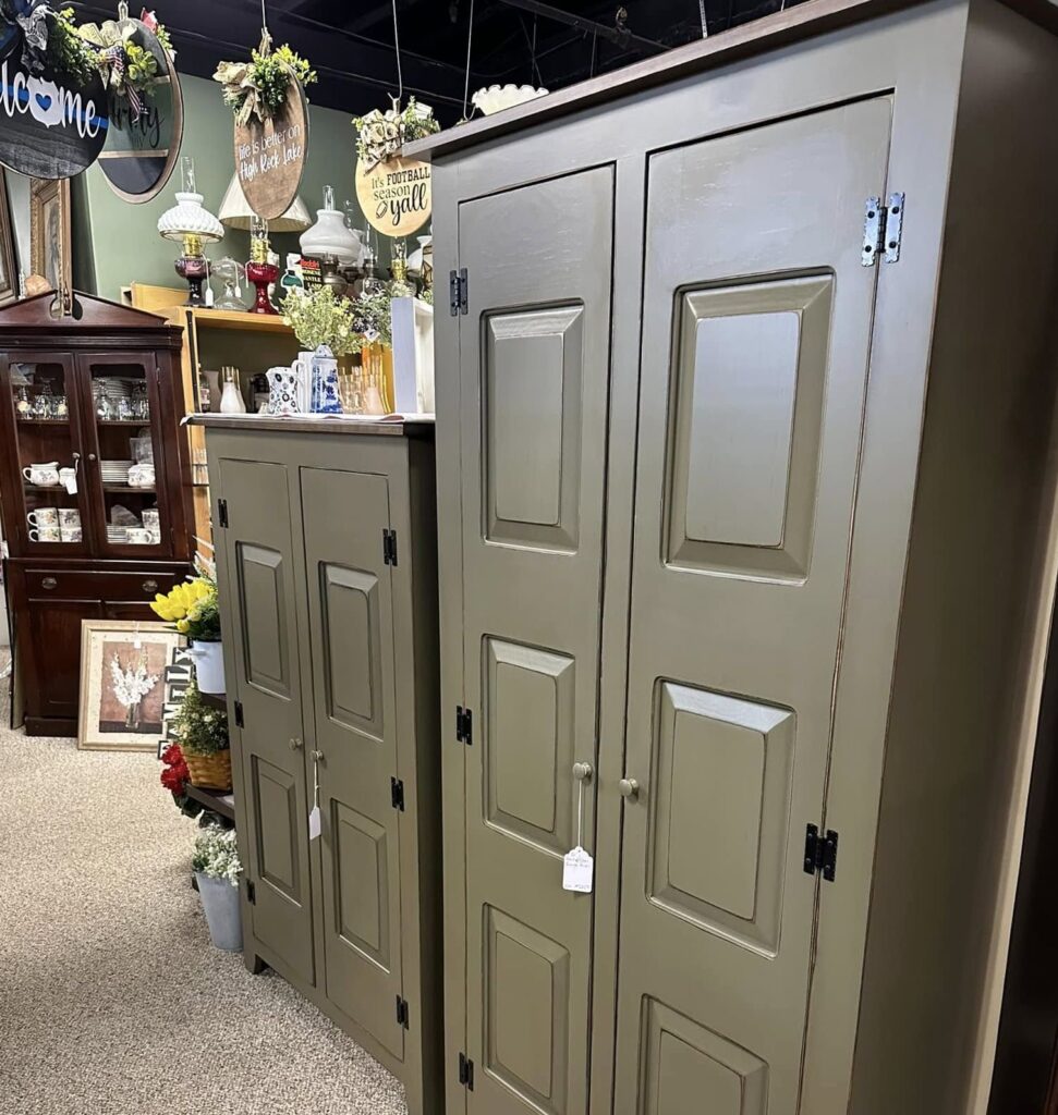 Primitive furniture in Galax antique stores including painted cupboards and wooden cabinets